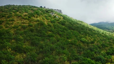 A flyover from the bottom up the mountainside with a vineyard at its base. The Stock Footage 223048787
