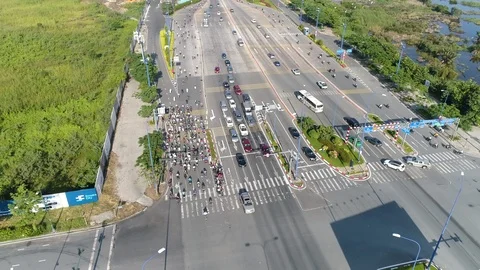 Flyover of busy Vietnam intersection on a clear morning Stock Footage 124504450
