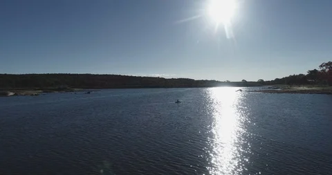 Flyover of canoe in sunset Video stock 100615145