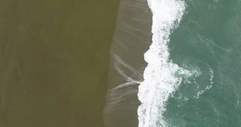 Flyover directly above Pacific Ocean waves on Cape Blanco State Park Stock Footage 289304877