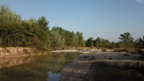 Flyover downstream slow river sunset Video stock 111298643