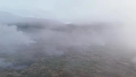 Flyover drone shot of steaming hot springs at great Geyser in Iceland Stock Footage 279682182