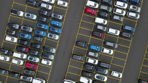 Flyover drone view top down on parked ca... | Stock Video | Pond5