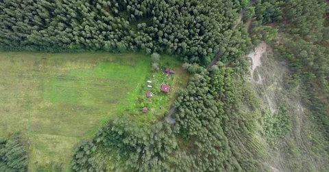 Flyover a farm with big field surround by the wood and lake Video stock 85129643