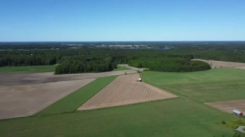 Flyover green spring agriculture fields in northern boreal forest Stock Footage 277016826