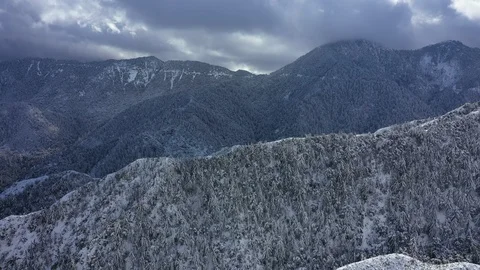 Flyover mountain range covered in snow Stock Footage 120621805