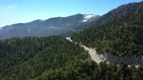 Flyover mountain side road Stock Footage 132872801