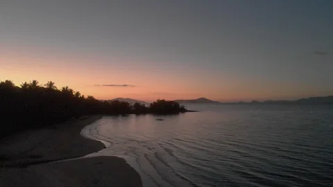 Flyover ocean beach Philippines by sunset Stock Footage 105827489
