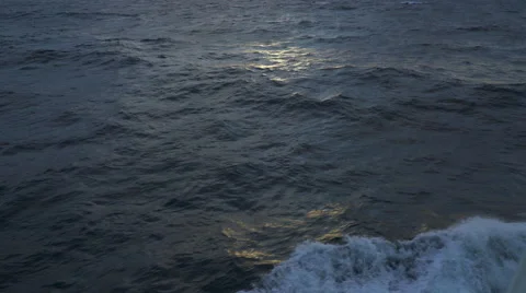 Flyover of open sea at sunset - dark water in arctic sun Stock Footage 67305357