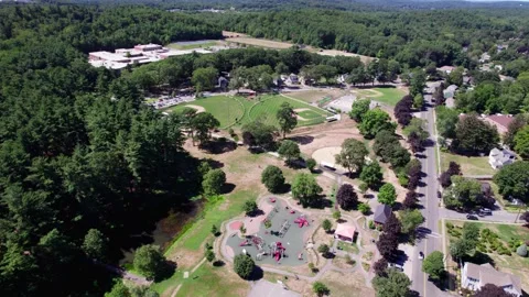Flyover Recreation fields in Amesbury Stock Footage 323286016