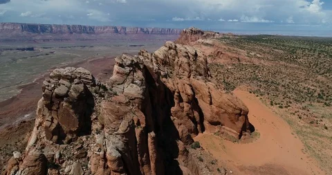 Flyover of Red Rock Cliffs with Grand Canyon Lands in Distance Stock Footage 94639546