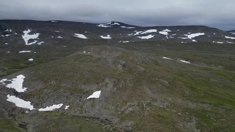 Flyover remote rolling rugged arctic tundra landscape under overcast Stock Footage 345418485