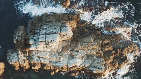 Flyover the rocks into the sea Stock Footage 100551923