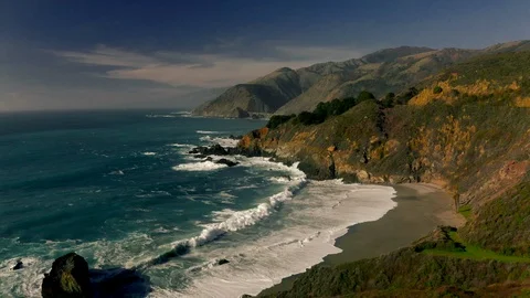 Flyover of rugged Pacific Ocean coast and rocks, Route 1, Pacific Coast Highway, Stock Footage 131339028