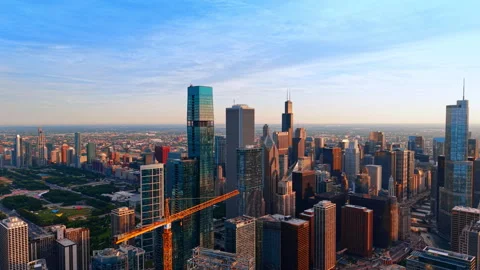 Flyover the skyscraper under construction with a huge crane by its side. Vast Stock Footage 342076759