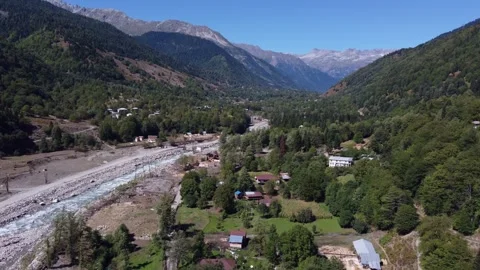 Flyover tiny river valley village of Kvemo Marghi in Georgia Caucasus 動画素材 295189064