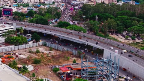 Flyover with underpass road, traffic flow, indian oil petrol bunk and BHEL Stock Footage 344059727