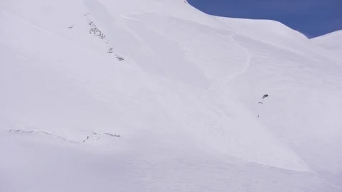 Flysurfer surfing in mountain slope Stock Footage 77806098