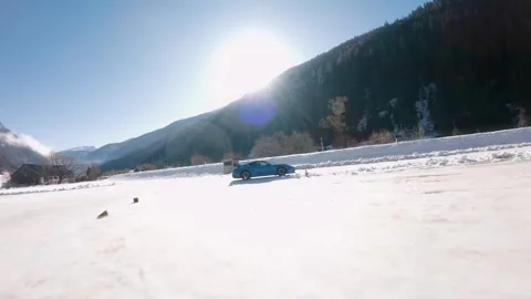 Flythrough Drone Shot – Winter Road &amp; Sports Car 4K 100FPS (Editorial) Stock Footage 309483800