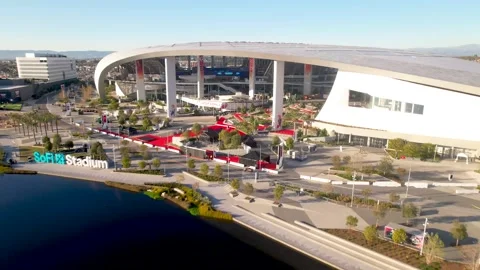 Flythrough over pond and red carpet towards SoFi Stadium 2022 Superbowl LVI 56 Stock Footage 169917487