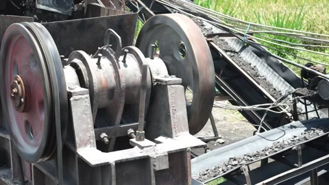 Flywheel in a stone crushing machine Stock Footage 273931313
