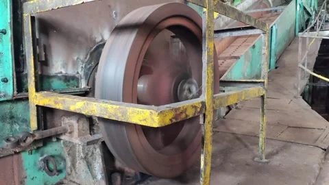 The flywheel of a sugarcane chopper Stock Footage 241042266