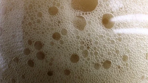 Foam and bubbles rising beer line Stock Footage 71800811