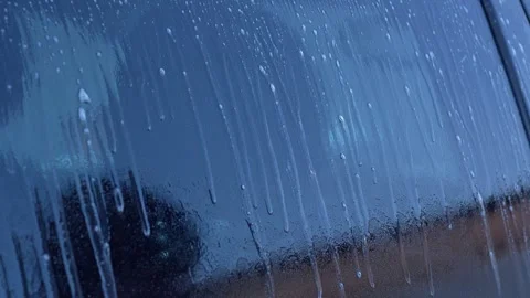 Foam and water dripping down car window in winter. car care, window washing Stock Footage 328532431