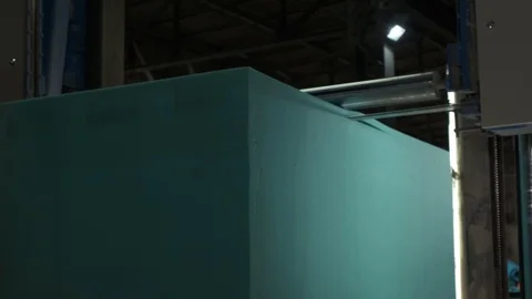 Foam bar is sawn into thin layers with sharp saw, conveyor blanks for mattresses Stock Footage 119197995