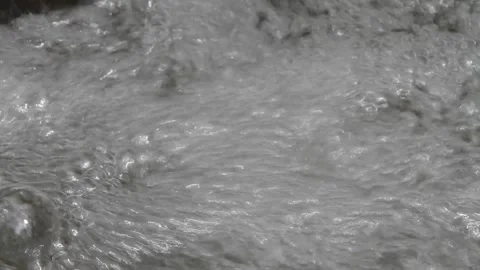 Foam at the base of a Small Waterfall Stock Footage 154408184
