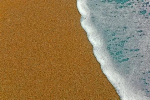 Foam on the beach Stock Photos
