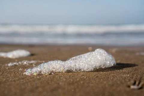Foam on the beach Stock Photos