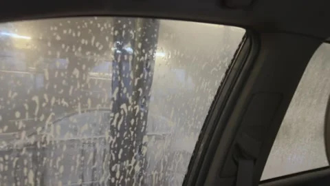 Foam being applied on windshield by car wash robot, Concept of automation 動画素材 341865891