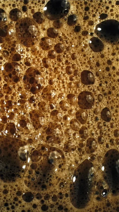 Foam with black coffee. Top view. Filmed on a high-speed camera at 1000 fps Stock Footage 335361135