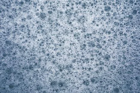 Foam blue from soap bubbles as a background for design. Foto stock