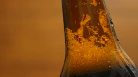 Foam in a brown bottle of beer (close-up, LR Pan) Stock Footage 67294443