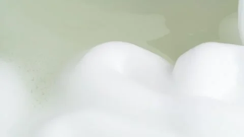 Foam bubble from soap or shampoo falling in the water. Soap foam texture su.. Stock Footage 272588592