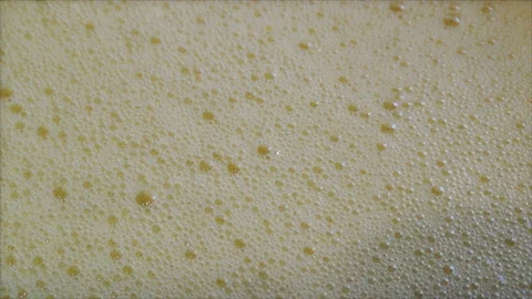Foam with bubbles after beating the eggs with a whisk. Stock Footage 167120403