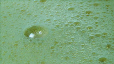 Foam with bubbles after beating the eggs with a whisk. Stock Footage 172524274