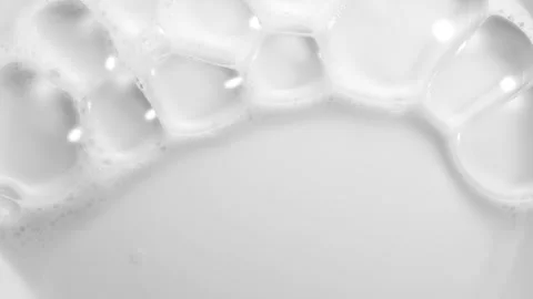Foam bubbles background. Moving Soap foam popping bubble, white backdrop Stockbeeldmateriaal 333015033