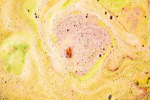 Foam bubbles form surface bath bomb dissolve water Stock Photos