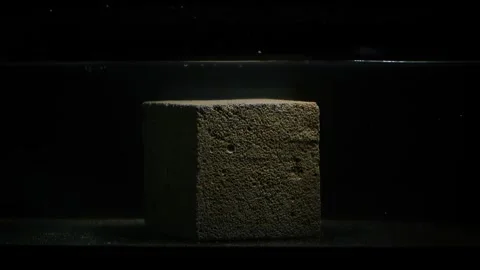 Foam concrete cube floating in water laboratory test Stock Footage 250345448