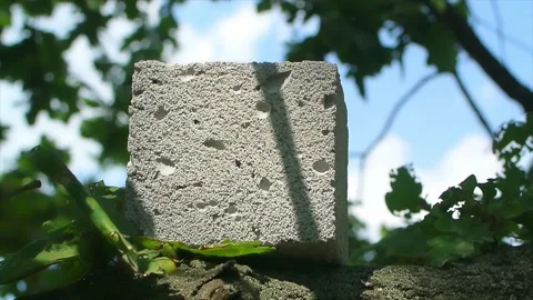 Foam concrete cubic block on a sand tree at sunny day close up Stock-Footage 184537535