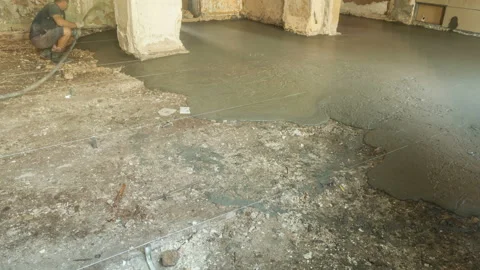 Foam concrete insulation. Group of workers pouring floor Stock Footage 144367342