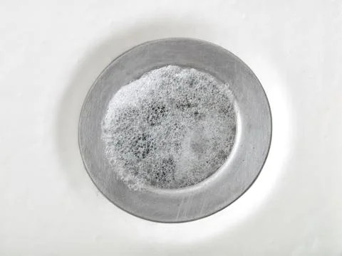 Foam in drain Stock Photos