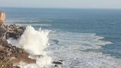 Foam explosion against the cliff Stock Footage 165578137
