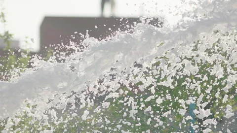 Foam flies out of the fire hose in a jet for extinguishing the fire. Stock Footage 240701077