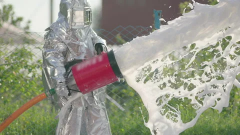 Foam flies out of the fire hose in a jet for extinguishing the fire Stock Footage 240701147