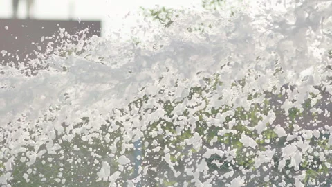 Foam flies out of the fire hose in a jet for extinguishing the fire. Stock Footage 240701164