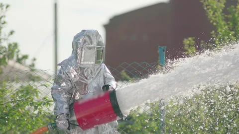 Foam flies out of the fire hose in a jet for extinguishing the fire Stock Footage 240701215